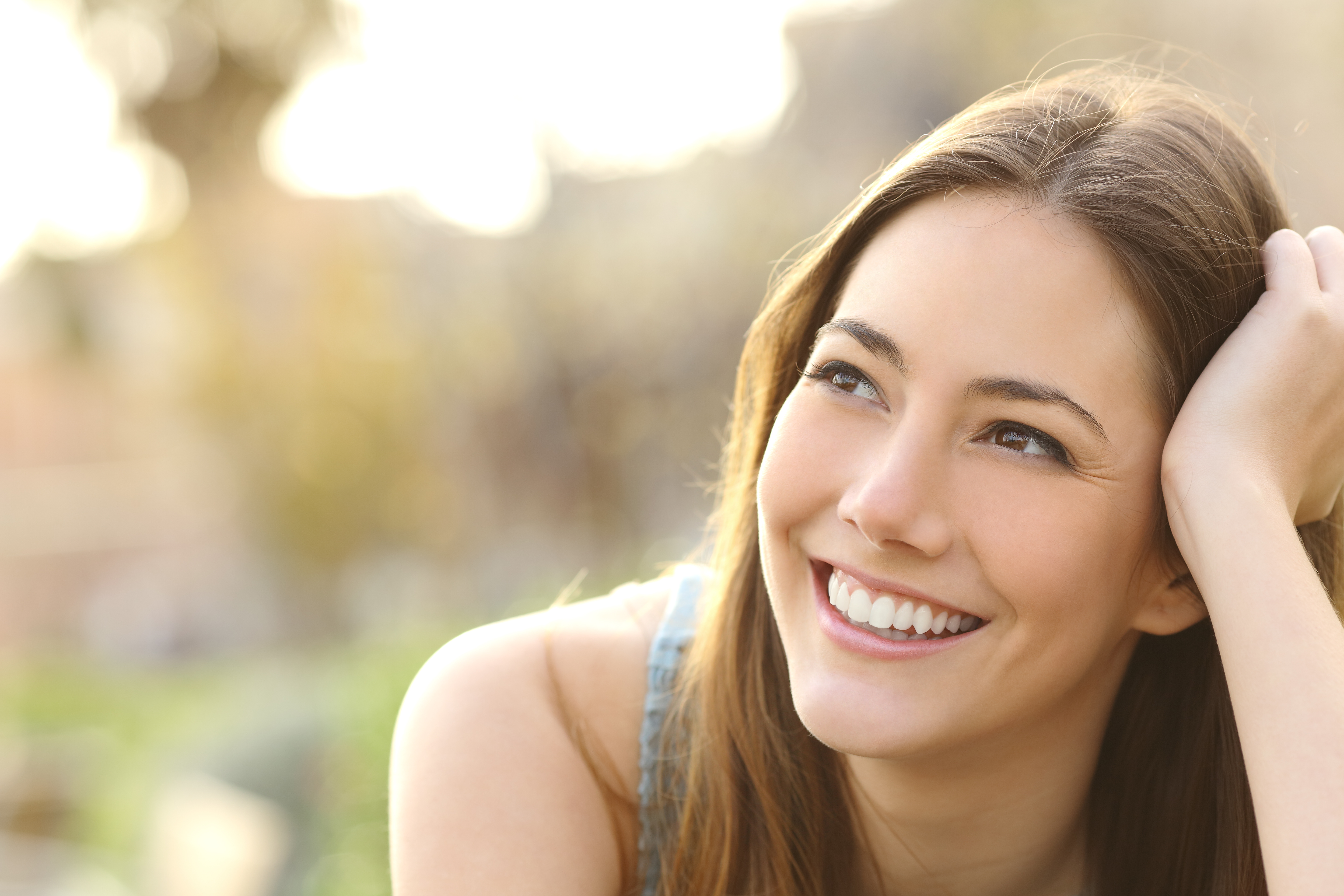 Woman with white teeth thinking and looking sideways - Sharon Stokes ...